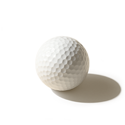 White golf ball on a plain background